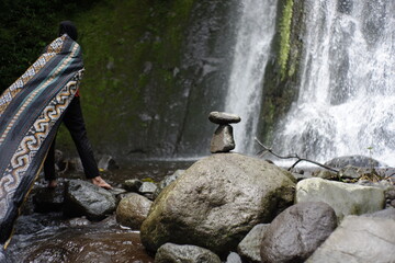play rock balance in the river water flow. relaxation in the cool tropical wilderness. balance rock...