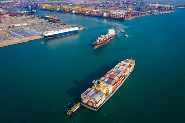 Aerial view two container ship and tug boat to quayside for load/unload container via crane