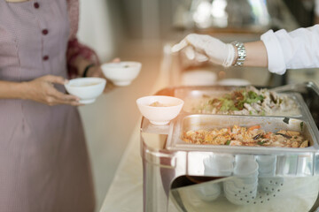 scooping the food, catering, dinner time