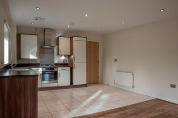 View of a kitchen area in a modern open plan apartment living area