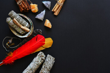 A top view image of a healing smudge kit on a black background. 