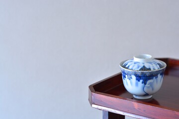 picture rice bowl. put on a Japanese lacquer serving tray. This is a very fine example of Japanese traditional antique &ldquo; imari ware &rdquo;. blurred background soft focus image. 