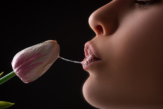 Sexy woman mouth and flowers. Oral sex, orgasm, blowjob, licking flower. Girl lips with tulips