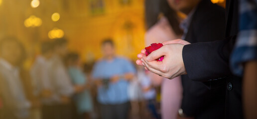 Holding flower petals at a wedding