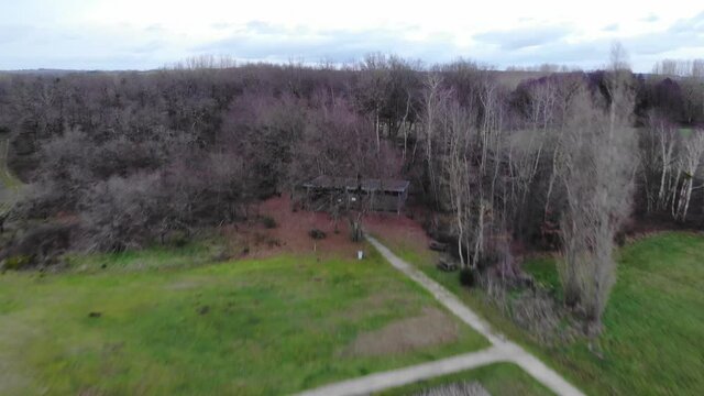 aerial drone view of roman ruins and forest in beautiful french countryside. trees and forest. Aerial view of pastures and farmlands in Brittany, France. Beautiful French countryside with green fields