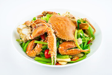 Fried flat crab with celery on a plate on white background