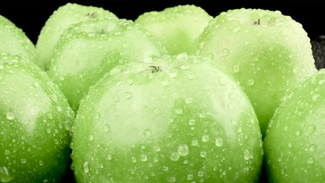 Fresh Green Apples. Macro shot of rotating Fruits.