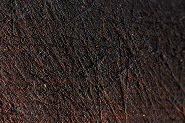 Dark texture of the burnt board, close-up background structure for the designer.