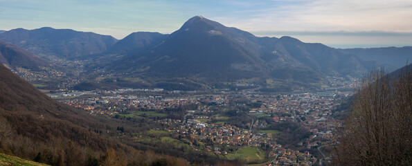 Albino, Bergamo, Italy. Aerial landscape of the town during winter time. View from the wood