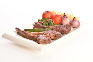 grilled beef steaks with spices isolated on white background
