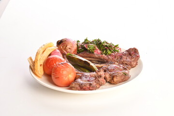 grilled beef steaks with spices isolated on white background
