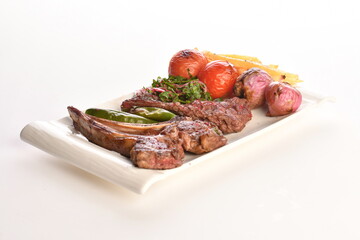 grilled beef steaks with spices isolated on white background
