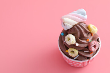 Chocolate cupcake isolated in pink background
