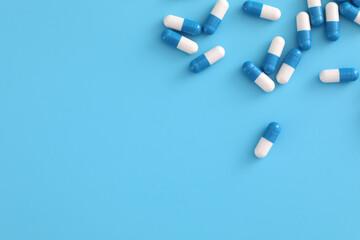 pills capsules isolated on blue background