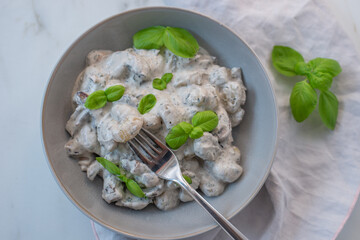 home made gnocchi with mushrooms and arugula