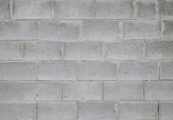 Gray wall made of large concrete blocks