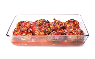 Dish of tasty baked vegetables on white background