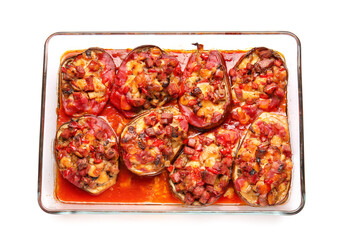 Dish of tasty baked vegetables on white background