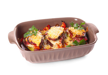 Dish of tasty baked vegetables on white background