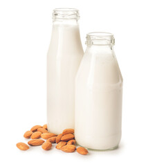 Bottles of tasty almond milk on white background