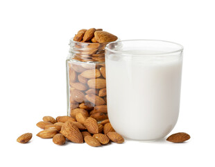 Glass of tasty almond milk and jar with nuts on white background