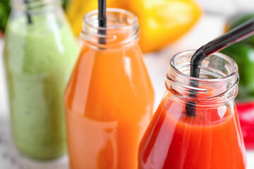 Bottles of different smoothie, closeup