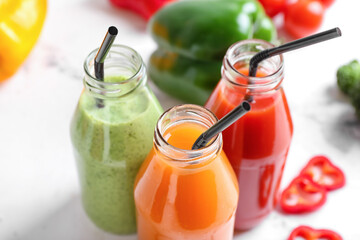 Bottles of healthy smoothie with different vegetables, closeup