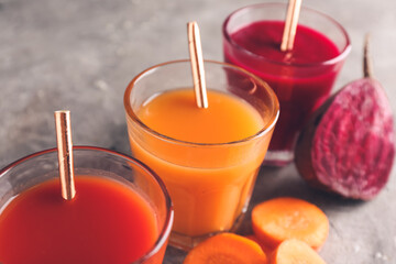 Composition with glasses of different smoothie on grey background, closeup