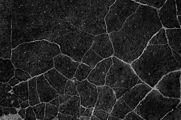 asphalt in cracks texture / abstract background cracks on asphalt road