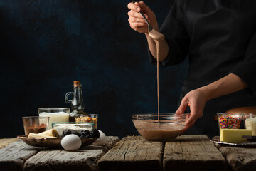 Chef preparing chocolate dough for baking, culinary recipes, making sweets, recipe book and cooking