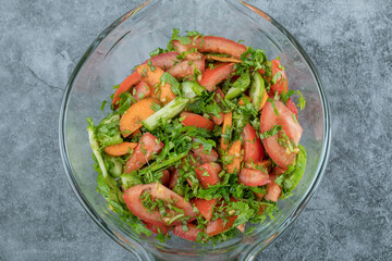 Fresh vegetable salad on in glass bowl