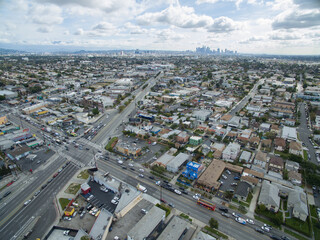 Fototapeta premium Aerial view of the Mid-City neighborhood with downtown Los Angeles in the background