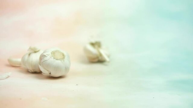 Fresh garlic rolling rolling into. Close-up.