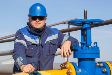 The mechanic - the repairman , operator production gas, Oil, gas industry. gas conditioning...