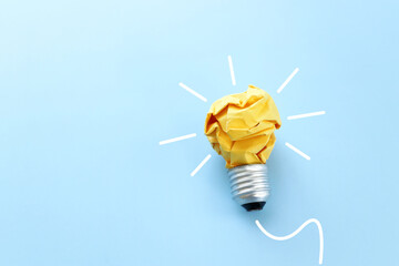 Education concept image. Creative idea and innovation. Crumpled paper as light bulb metaphor over...