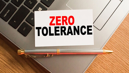 Notepad with inscriptions ZERO TOLERANCE on a white background. business concept.