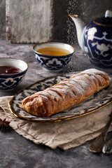 Traditional tasty apple pie, strudel, served in a beautiful oriental plate