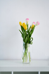 Spring holiday bouquet of yellow and pink tulips