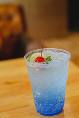 Blue Cocktail Drink with cherries and lemon