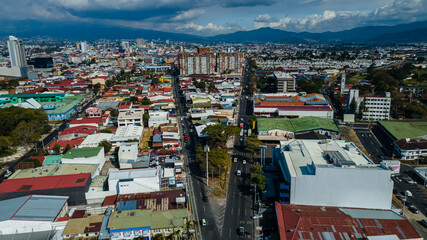 Beautiful aerial view of the City of San Jose Costa Rica, Its park Sabana, buildings at sunset 