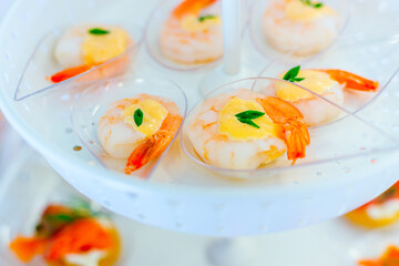 shrimp with sauce on Plastic spoon, appetizer 