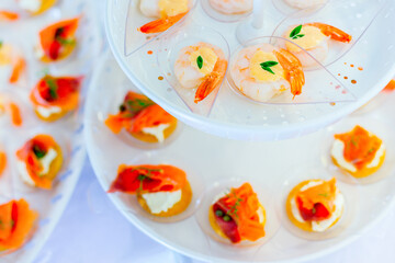 shrimp with sauce on Plastic spoon, appetizer 