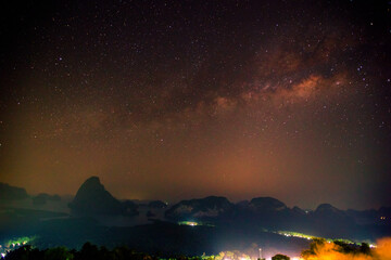 Naklejka premium Abstract background of celestial stars, blurred wallpaper of the Milky Way at night, is a natural beauty. Seen during the time of the season