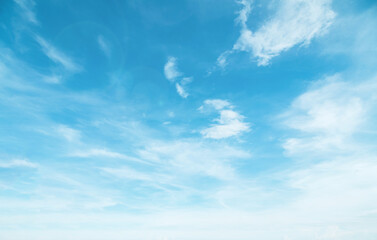 Summer Blue Sky and white cloud white background. Beautiful clear cloudy in sunlight spring season. Panoramic vivid cyan cloudscape in nature environment. Outdoor horizon skyline with spring sunshine.