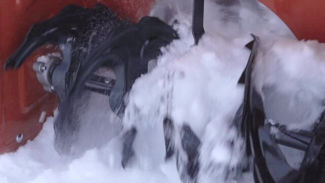 Spectacular slow-motion video of a snow blower. Snow sucking in with the snow blower auger
