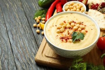 Concept of cooking hummus on wooden background
