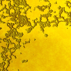 Gold metal surface with the roughness and texture of the bark.