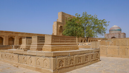 Beautiful mughal era carved sandstone cenotaphs in courtyard of Isa Khan Tarkhan II tomb in UNESCO listed Makli necropolis, Thatta, Sindh, Pakistan