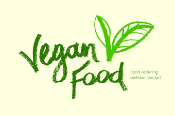 Vector lettering for vegan food icon. Handwritten vegetarian cooking emblem. Chalk texture. Hand drawn vegan label design. Leaf icon. Organic raw food concept. Stamp of vegetarian restaurant badge.