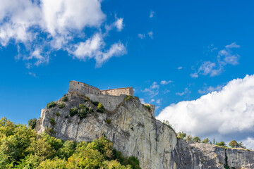 Beautiful view of the rock spur on which the fortress of San Leo stands, Rimini, Italy, on a sunny...